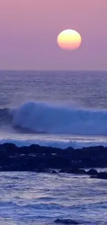 Serene ocean waves at sunset with a vibrant lilac sky.