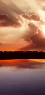 Vibrant sunset over a calm lake with reflections and stunning sky colors.