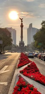 Cityscape with sunset and red flowers lining the road.