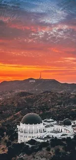 Sunset over Griffith Observatory, vibrant colors and iconic Los Angeles skyline.