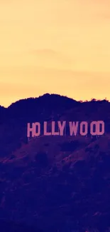 Hollywood sign at sunset, with vibrant orange skies.