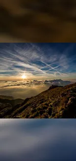 Scenic sunset over mountain landscape with vibrant clouds and sky.