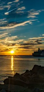 Serene sunset over ocean with vibrant sky and calm waters.