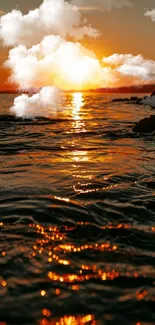 Breathtaking sunset over the ocean with clouds and vibrant orange reflections.