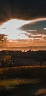 Sunset landscape with rolling hills under a dramatic sky.