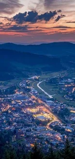 Vibrant sunset over a tranquil valley landscape.