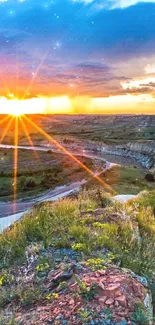 Vibrant sunset over a scenic valley with a winding river.