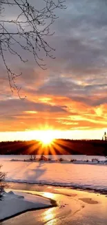 Stunning sunset over a snowy landscape with an icy river.