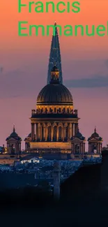 St. Paul's Cathedral dome silhouetted against a vibrant orange sunset.