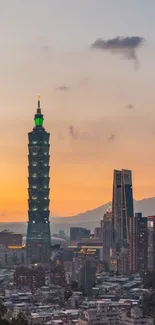 Taipei skyline at sunset with Taipei 101 against an orange sky.