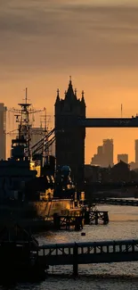 Scenic sunset over London’s Tower Bridge with city silhouette.