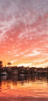 Serene sunset over calm waters with pink and orange sky hues.