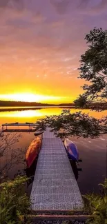 Mobile wallpaper featuring a sunset view over a tranquil lake with a pier.