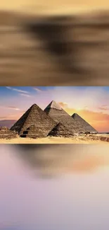 Beautiful sunset over Egyptian pyramids, perfect for mobile wallpaper.