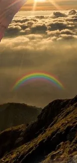 Sunset with rainbow over mountains through an archway.