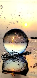 Sunset through a glass sphere reflecting on water with splashing droplets.