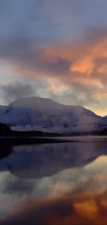 A stunning sunset reflection over a tranquil mountain landscape.