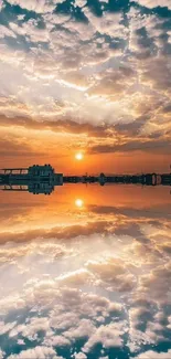 Stunning sunset reflected perfectly over water with colorful clouds.