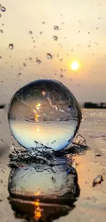 Crystal sphere reflecting sunset on water surface.