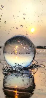 Sphere reflecting a sunset over water with droplets and a warm sky.