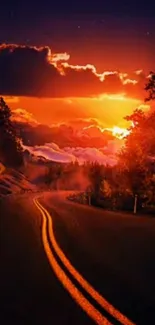 Vibrant sunset road with fiery sky and forest edge, perfect for mobile wallpaper.