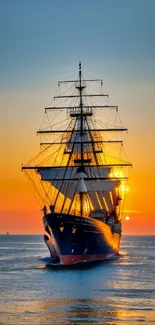 Majestic sailboat against a sunset over calm ocean waters.