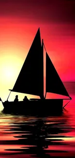 Sailboat silhouette on a vibrant red sunset background.