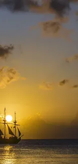 Silhouetted sailing ship at sunset on calm ocean.