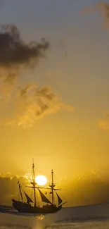 A ship sailing against a golden sunset background on the ocean.