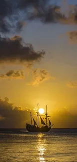 Ship sailing at sunset with golden sky and calm ocean.