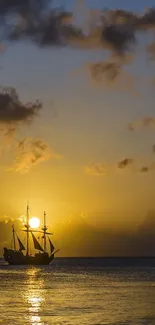 Sunset over ocean with ship silhouette and golden hues.