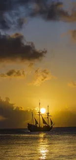 Historic ship sails at sunset, silhouetted against a golden sky.