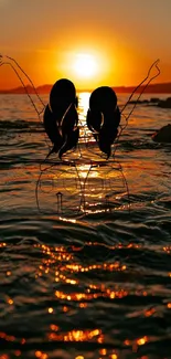 Silhouette in the sunset over the beach with orange hues.