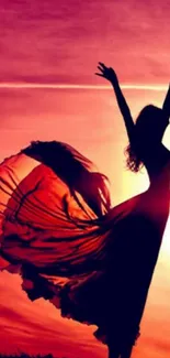 Silhouette of a woman dancing at sunset with flowing dress.