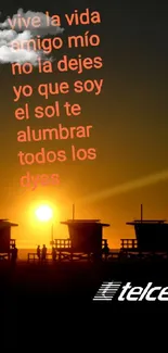 Vibrant sunset with silhouette huts and Spanish quote on a mobile wallpaper.