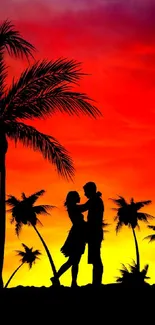 Romantic silhouette under a sunset with palm trees.