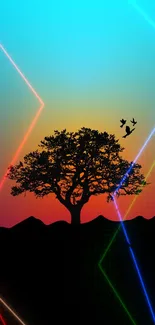 Silhouette of tree against vibrant sunset gradient sky with birds flying.