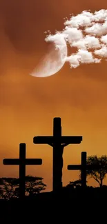 Silhouette of three crosses at sunset with a cloudy moonlit sky.