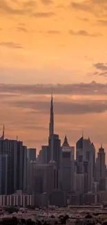 City skyline at sunset with orange sky background.