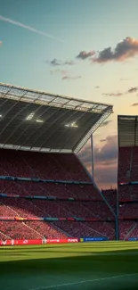 Soccer stadium at sunset with lights and clouds.