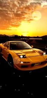 Yellow sports car under a vibrant sunset sky.