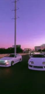 Two white sports cars under a violet sunset sky on a busy urban street.