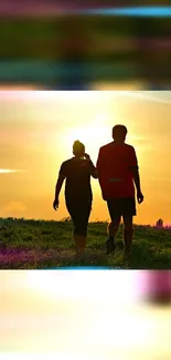 Two people walking at sunset on a grassy hill with vibrant colors.