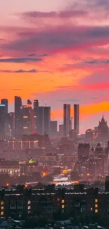Urban skyline at sunset with vibrant orange sky.