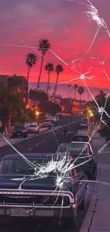 Sunset over an urban street with classic cars and palm trees.