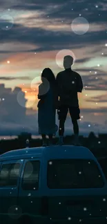 Silhouette of couple on van roof at sunset.