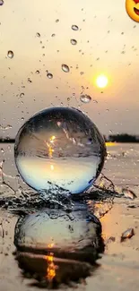 Sunset with water splash and crystal ball reflecting the view.
