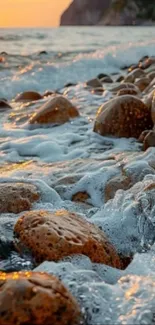 Sunset waves crashing on rocky coast