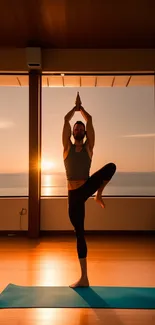 Man in yoga pose with sunset reflection on wooden floor.