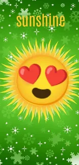 Sunshine emoji with heart eyes on a green background with snowflakes.